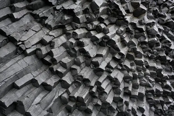 Black basalt column formation in Iceland. Closeup. Horizontal.