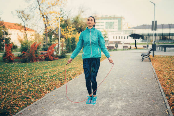 istock Sportswoman jumping rope 910667370