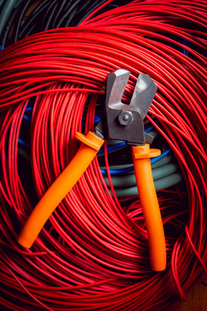 istock Electrical equipment. Electricity cable and crimper. 910667450