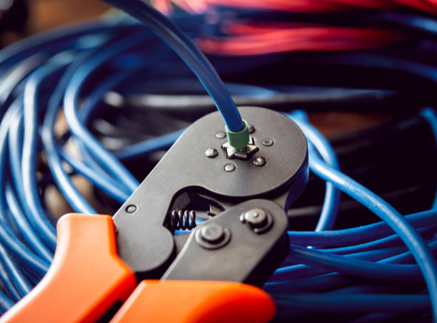 istock Electrical equipment. Electricity cable and crimper. 910668384