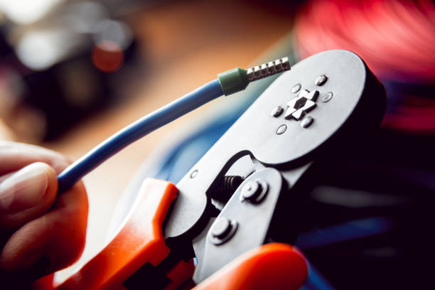 istock Electrical equipment. Electricity cable and crimper. 910668562