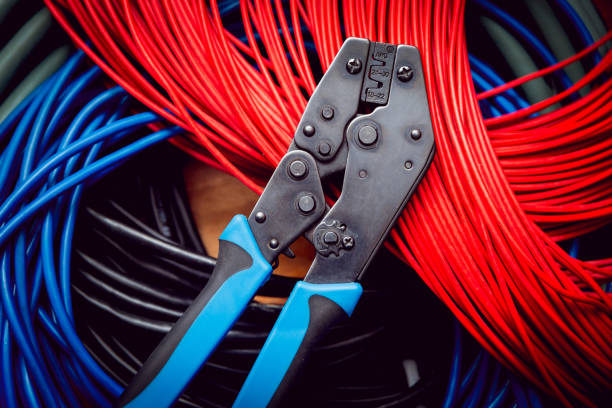 istock Electrical equipment. Electricity cable and crimper. 910678426