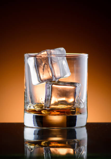 istock A glass of whiskey with ice 910682304