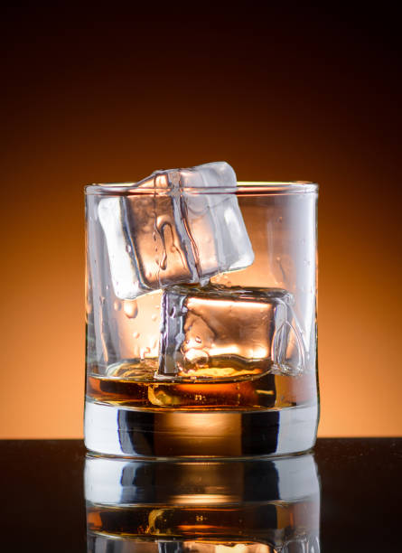 istock A glass of whiskey with ice 910682398