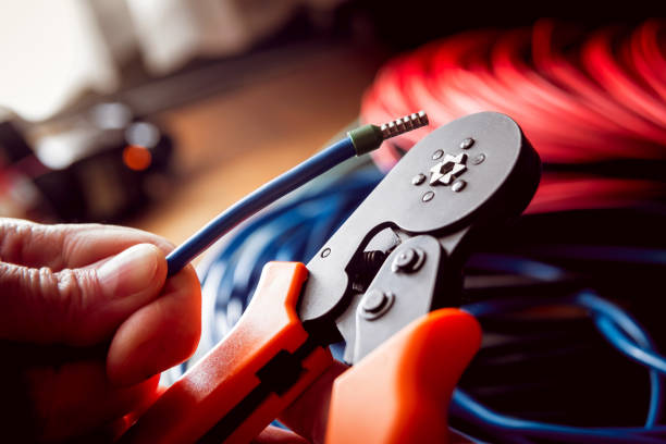 istock Electrical equipment. Electricity cable and crimper. 910690952