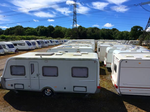 istock Caravans stored in rows on a sunny day. 910698078