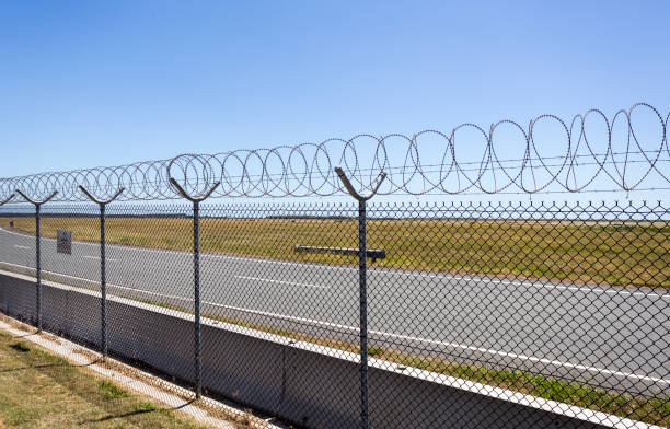 istock Razor and Barbed Wire Fence 910698124