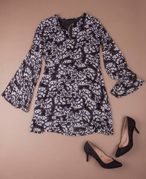 istock Spring dress and heels laid down on a brown background 910699160