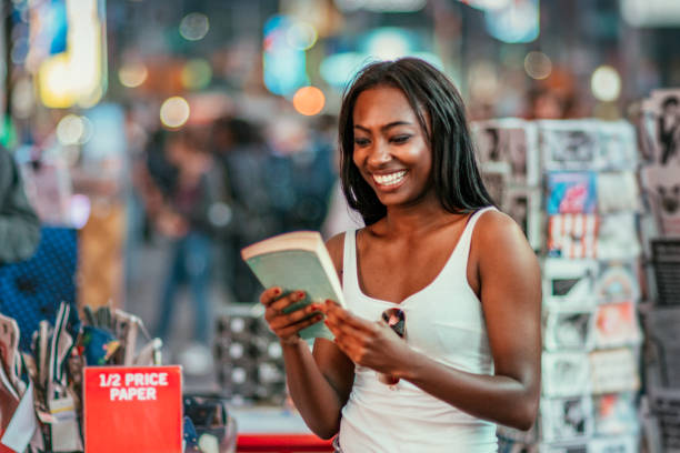 istock Woman Buying Books 910704152