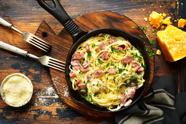 Traditional italian dish spaghetti carbonara with bacon in a cream sauce stock photo