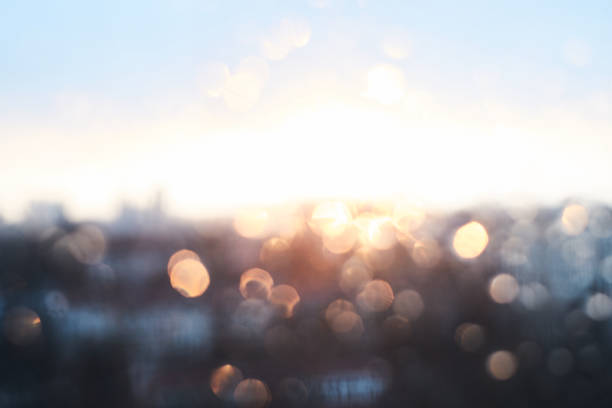 istock Rain drops texture on window glass with stunning vintage blue violet sunset light abstract blurred cityscape skyline bokeh background. Soft focus. 910707226