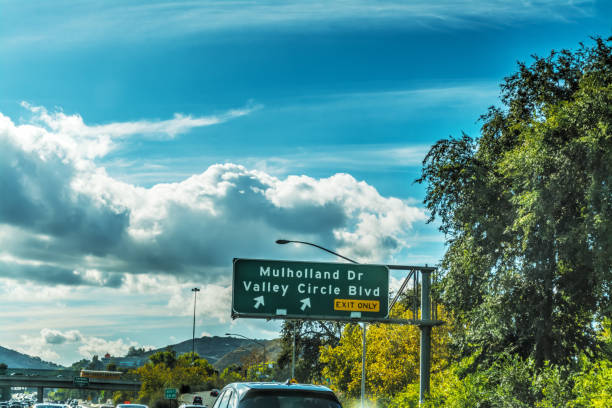 Mulholland drive exit sign in Los Angeles Mulholland drive exit sign in Los Angeles, California san diego freeway stock pictures, royalty-free photos & images