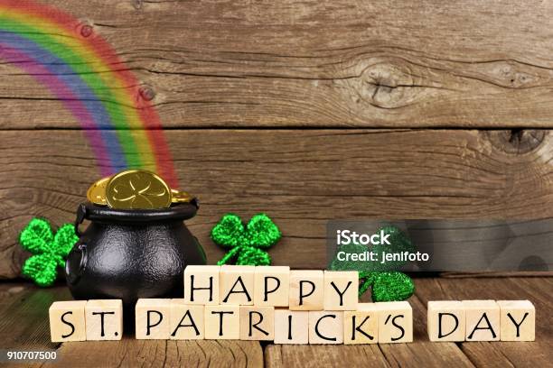 Happy St Patricks Day Blocks With Decor Against Wood Stock Photo - Download Image Now