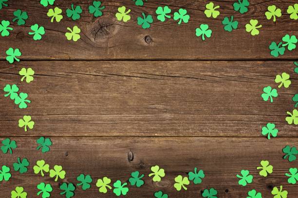 istock St Patricks Day shamrocks frame over rustic wood 910708056