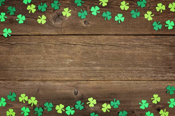 istock St Patricks Day shamrocks double border over rustic wood 910708100