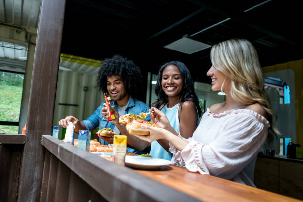 istock Group of people eating at a creative office 910714622