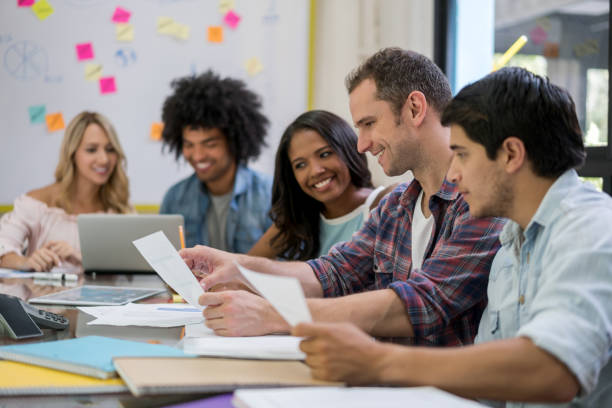 istock Designers working at a creative office and sharing ideas in a business meeting 910714688
