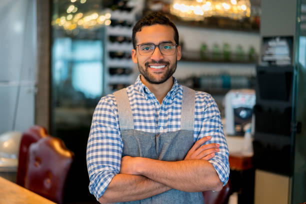 istock Happy waiter working at a restaurant 910714982