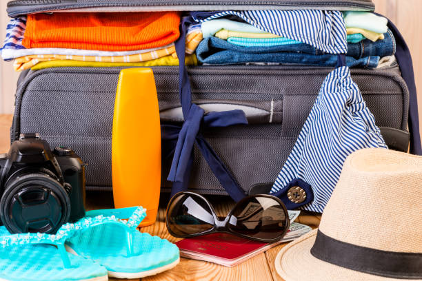 istock summer stylish women's things for a vacation at sea on a suitcase background 910715216