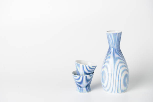 istock Close up of Japanese Sake drinking set on a white background. 910715342