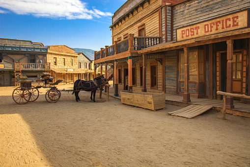 TABERNAS DESERT, ALMERIA ANDALUSIA / SPAIN - SEPTEMBER 18, 2011: Post office movie location set for spaghetti western in desert, horse drawn carriage. Protected wilderness area. Europe