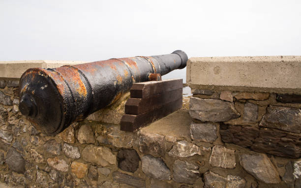 istock Ancient guns on a fortress wall 910719196