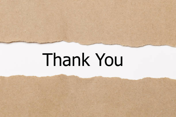 istock thank you word under torn paper 910721850