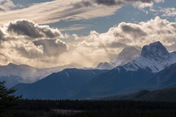 istock Moody clouds above rocky mountains 910725668