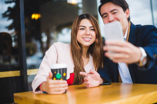 istock Happy business couple working in a coffee store 910725766