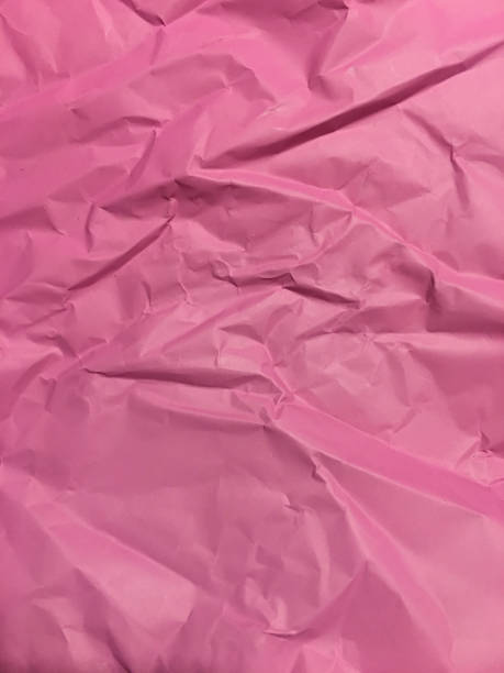 istock Pink creased paper tissue background texture 910726434