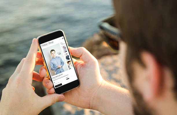 istock Man shopping with his mobile phone on the coast 910728876