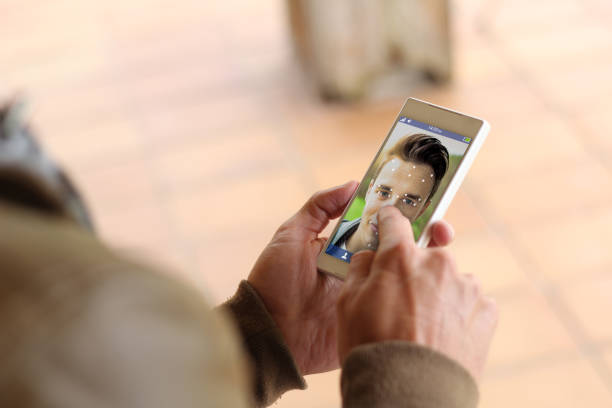 istock Brown young man smartphone face id 910728968