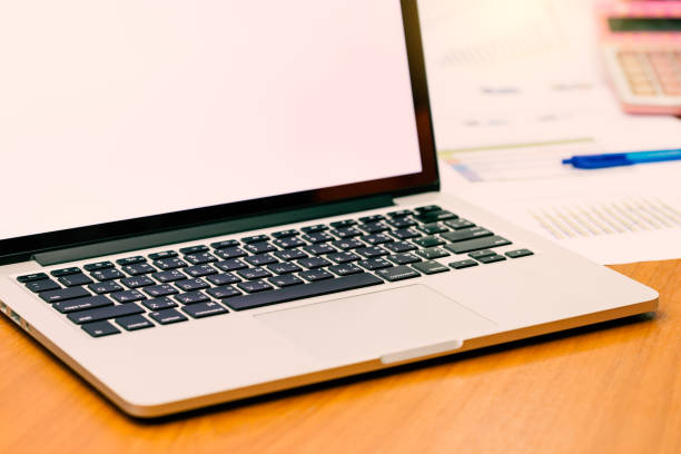 istock Computer laptop on business dest with blank screen for copy space. (Vintage tone) 910733280