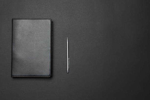 Notebook and pen on the desk stock photo
