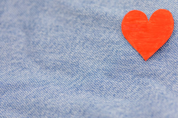 istock Paper red heart with Denim jeans texture background. Valentine Concept. Copy space 910745932