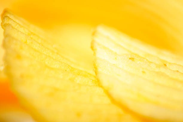 crinkly cut potato chips stock photo