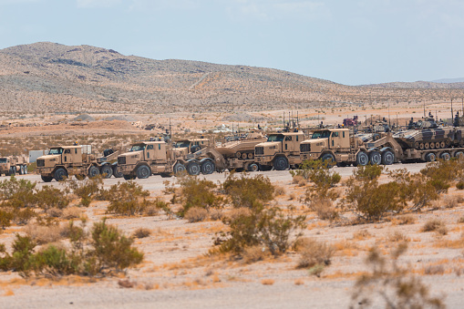 Convoy vehicles on deployment during war