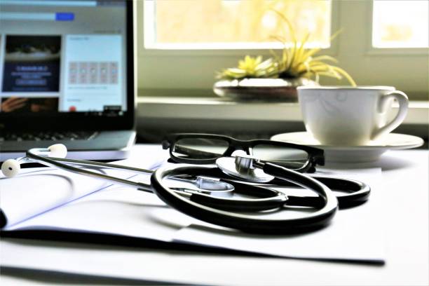 istock An concept Image of a desk with a stethoscope 910758442