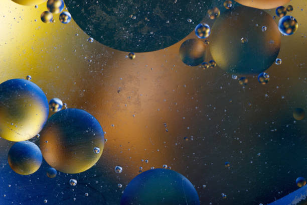 istock Abstract image with colorful circles and shapeless bodies on a colored background. 910761236