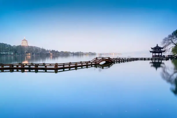 Landscape of West Lake. Long Bridge and Leifeng Pagoda. Located in Hangzhou, Jiangsu, China.