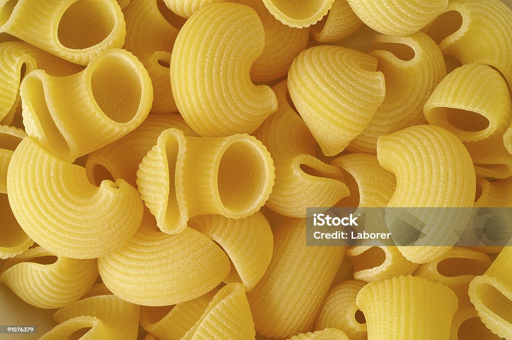 Elbows pasta (pipe rigate) background  Close-up Stock Photo