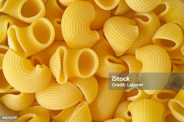 Elbows Pasta Background Stock Photo - Download Image Now - Close-up, Color Image, Concepts