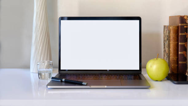 istock Stylish workspace with mockup blank screen laptop, books, smartphone on table 910765086