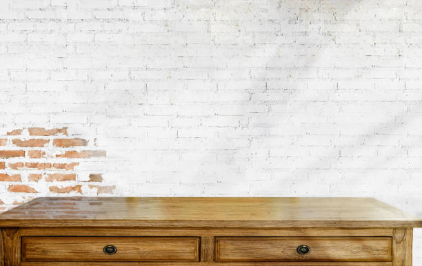 istock Empty wood table and white brick wall. for product display montage. 910765112