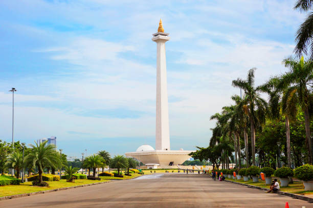 Indonesia. Jakarta. The national monument (Monas) The national monument or Monas is a 137-meter high tower in Central Jakarta symbolizing the fight for Indonesia's independence. On the top there is an observation deck, which offers wonderful views of the city. At the very top of the monument is "Flame of Independence" is a sculpture in the form of fire, covered in real gold, whose weight was 33 kg. jakarta stock pictures, royalty-free photos & images
