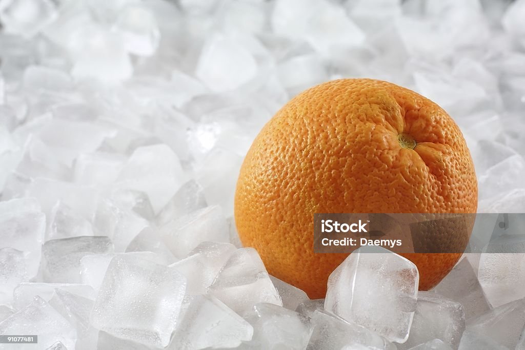 Orange auf Eis - Lizenzfrei Eingefroren Stock-Foto