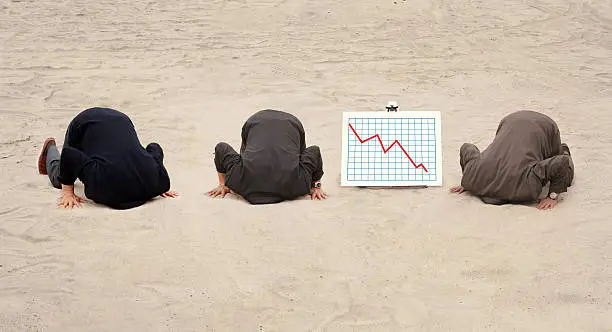 Photo of Three heads in the sand