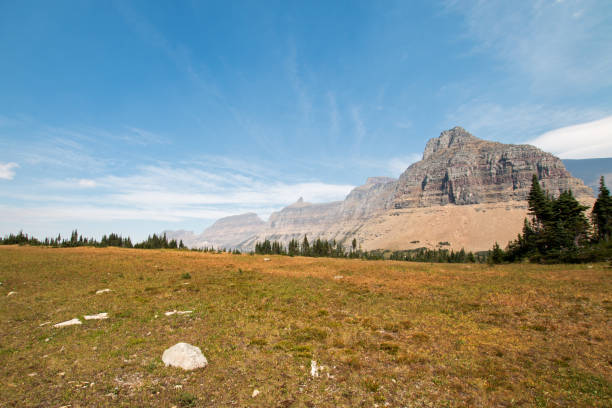 logan pass as seen from hidden lake hiking trail in glacier national park during the 2017 fall fires in montana united states - lake us glacier national park cloudscape cloud imagens e fotografias de stock
