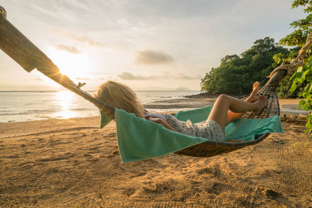 istock Relaxing time, girl on hammock 910778872