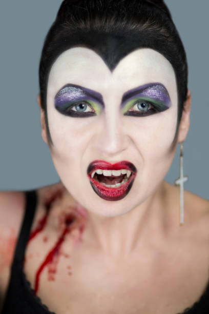 istock beautiful young woman creative make up 910779746